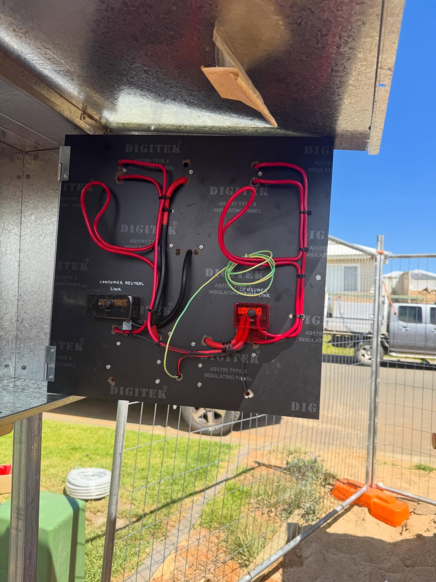 Newly wired consumer mains panel in a switchboard enclosure during a house rewiring job in Wagga Wagga